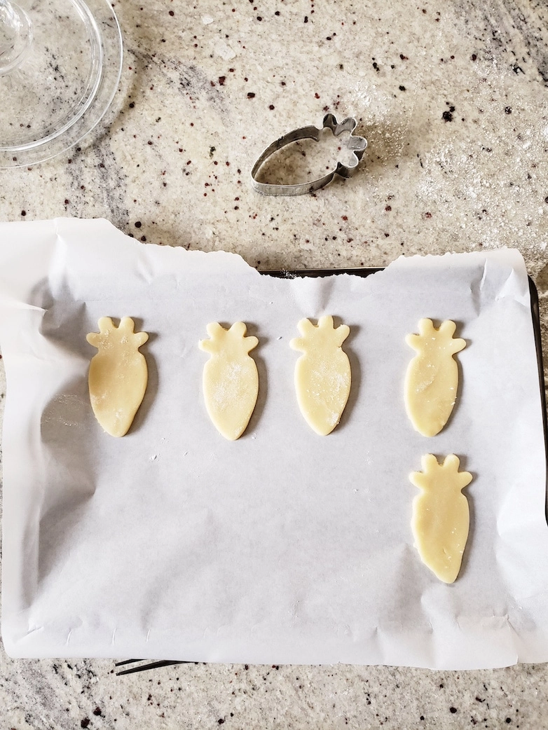 Carrot cookie cutter and dough cutouts