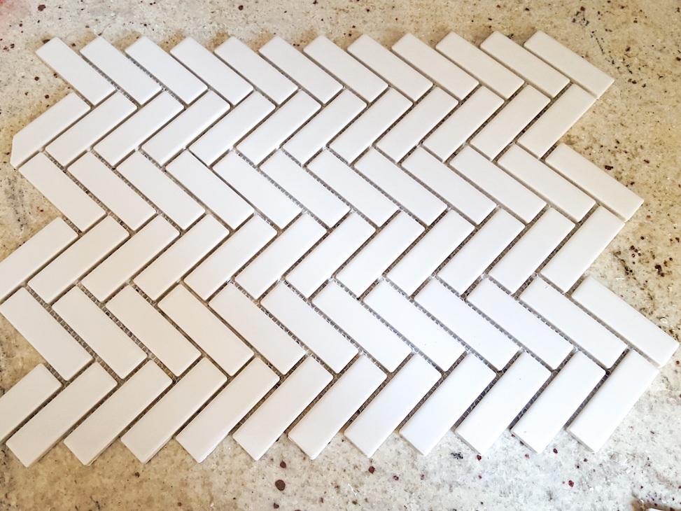 White herringbone pattern mosaic tile