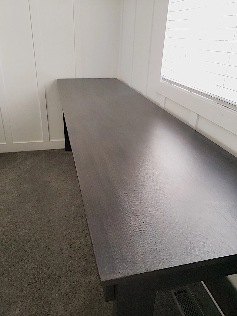 desk table top showing faux wood finish