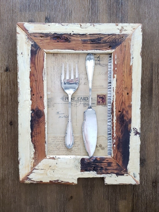 antique cutlery mounted on scrapbooking paper in a reclaimed wood frame 