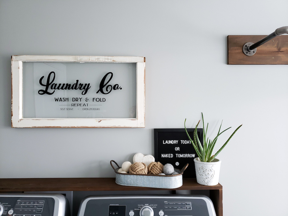 Laundry room decor: vintage laundry sign, dryer balls, succulent, letter board