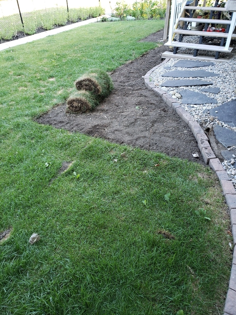 Removing grass to create an outdoor sitting area