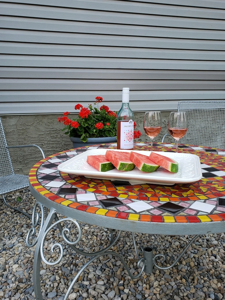 Wine and watermelon served at the outdoor sitting area