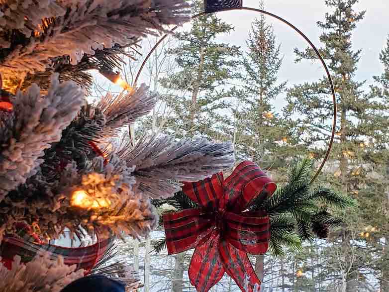 Wreath behind a Christmas tree