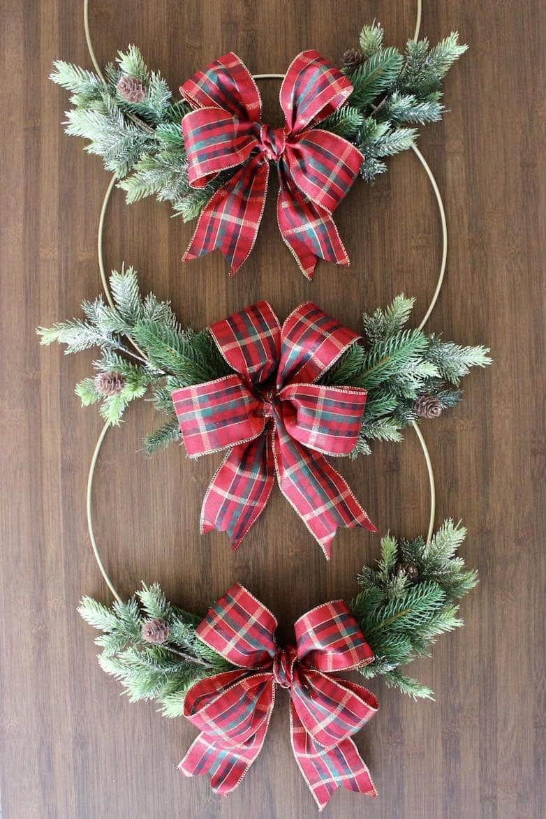 three interior Christmas wreaths