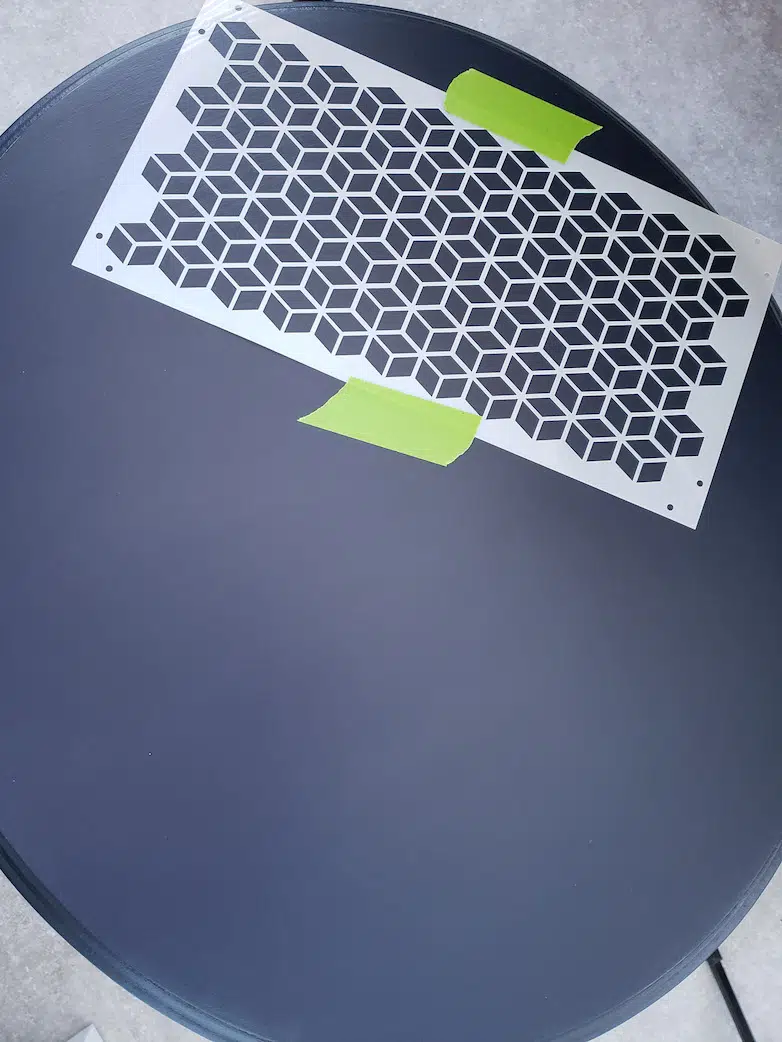 Using a stencil to paint on a table top