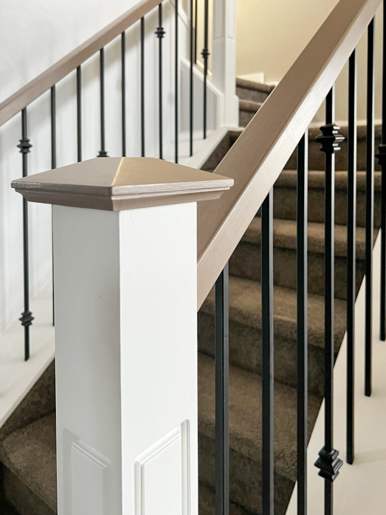 Hand railings and newel caps painted with a custom mixed brown paint color.