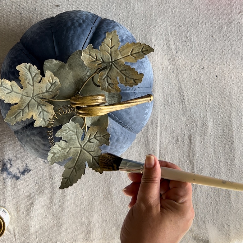 Brushing gilding was on the pumpkin stem and leaves