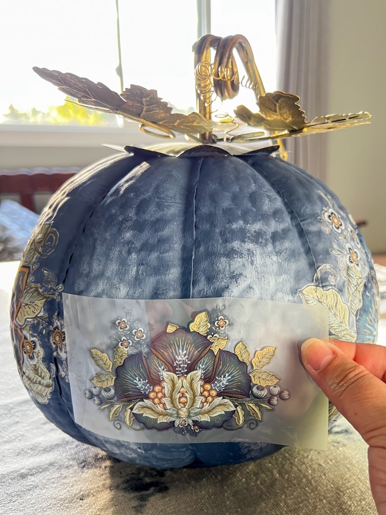 Decorating a pumpkin with transfers