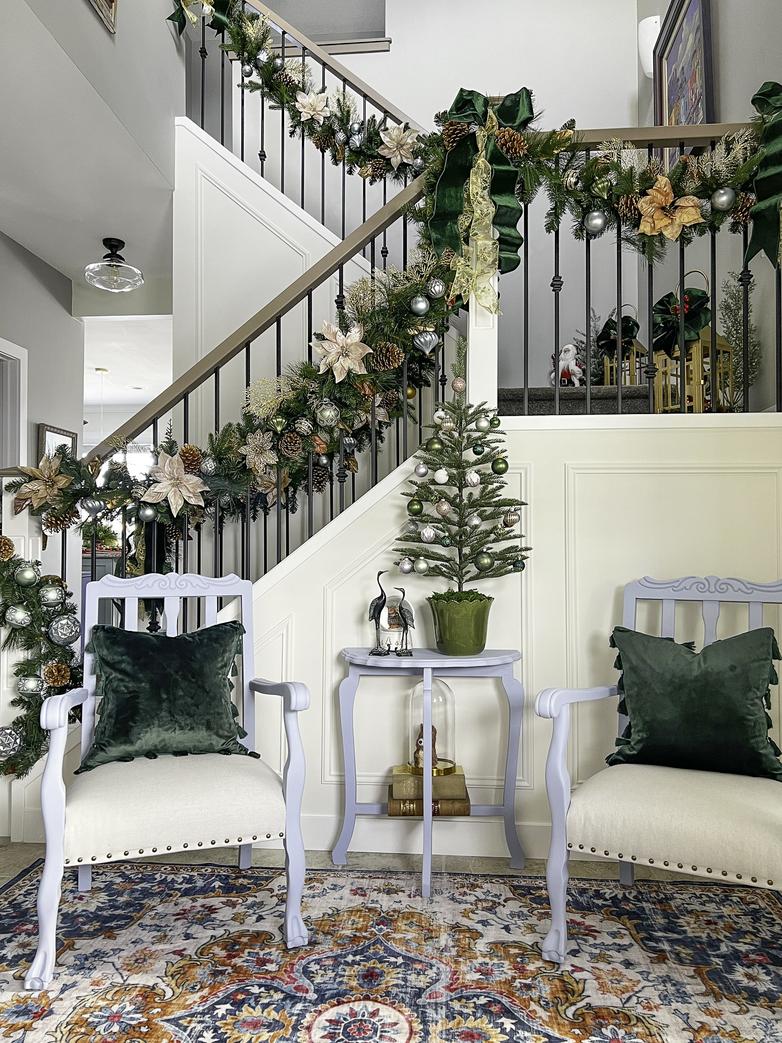 The entryway and stairs decorated for Christmas