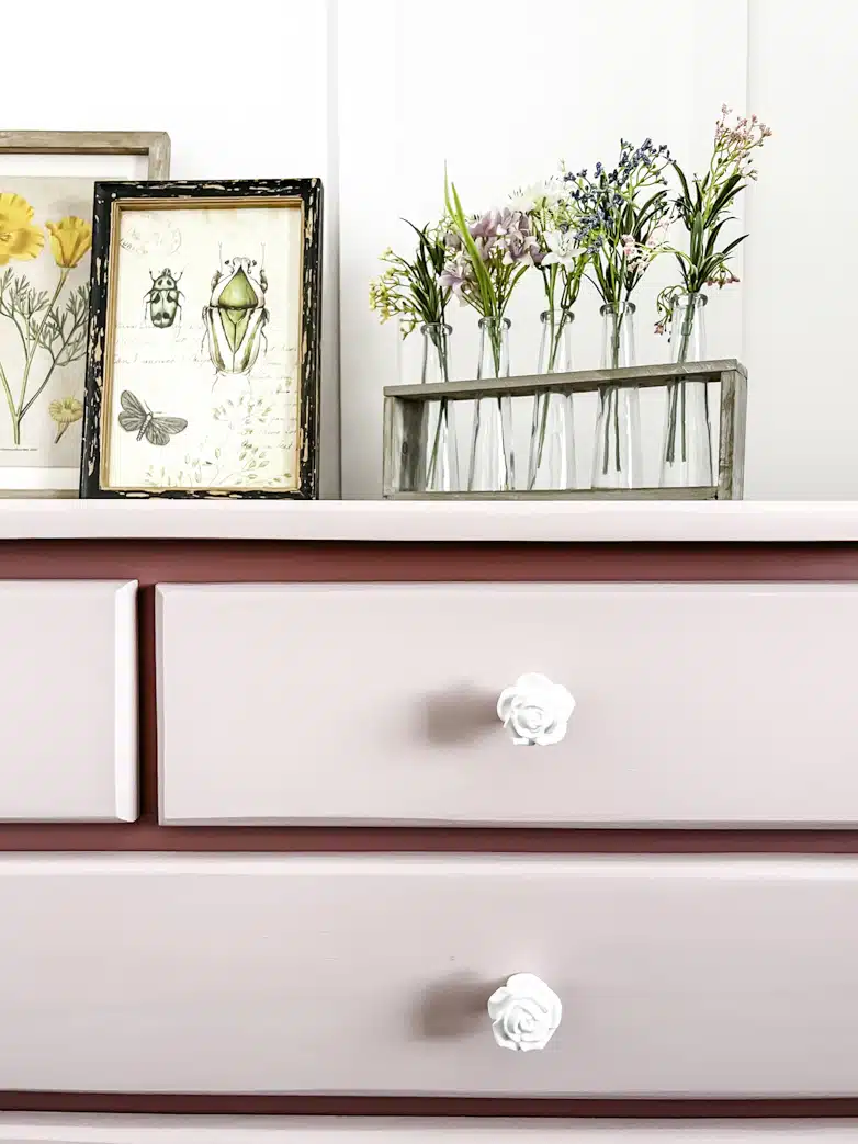 Chest of drawers after a makeover, painted in two shades of pink