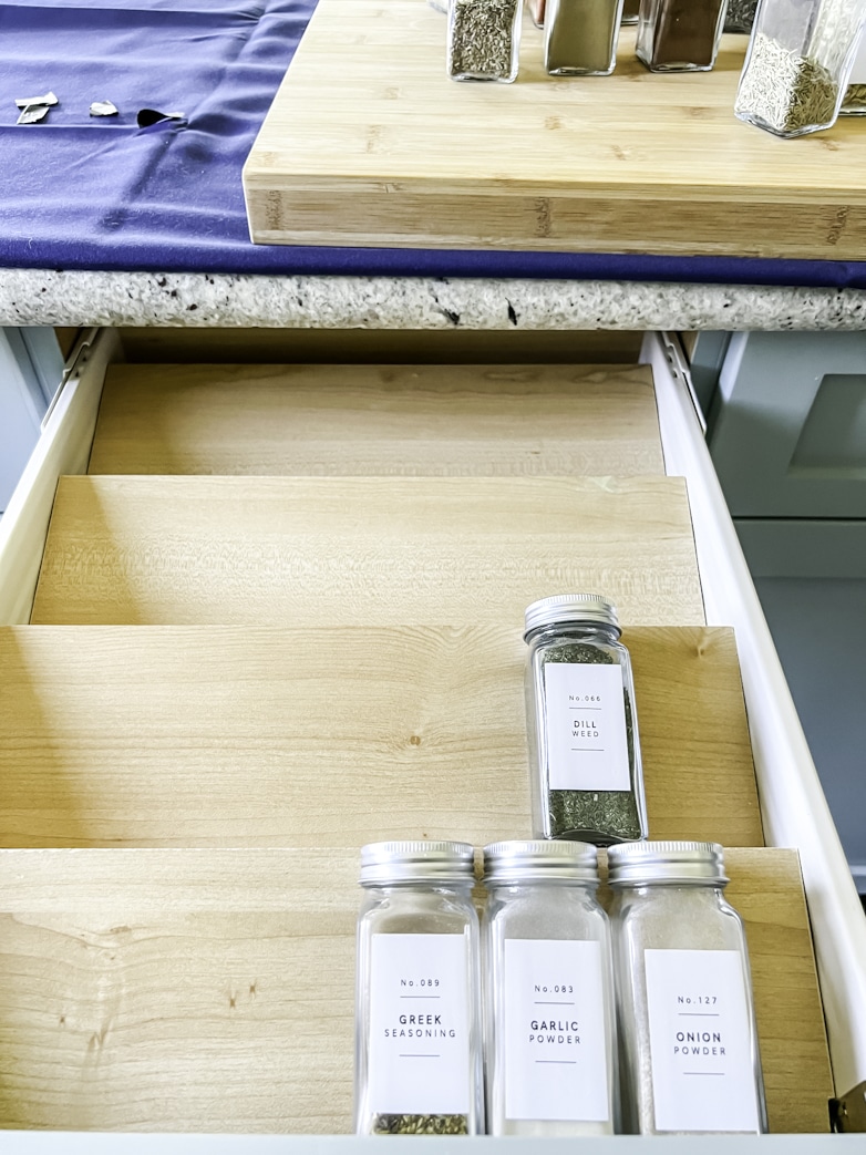 Arranging spice containers on the new DIY spice drawer organizer