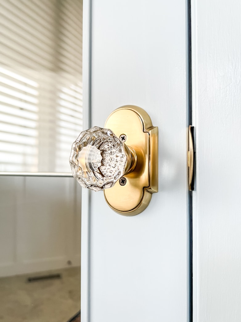 Newly installed door knob with brass and glass detail