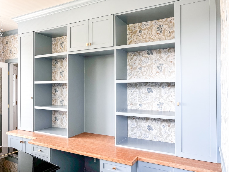 Built-in wallpapered bookcases