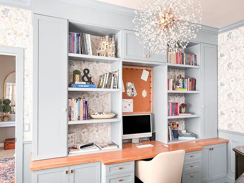 Blue office built-ins with a desk area