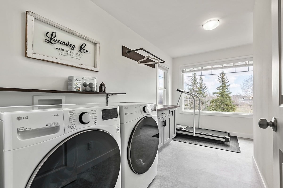 A laundry room with washer and dryer
