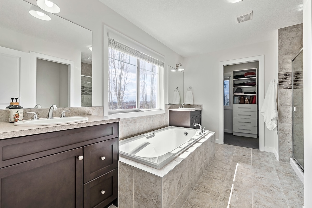 A bathroom with a tub and sink