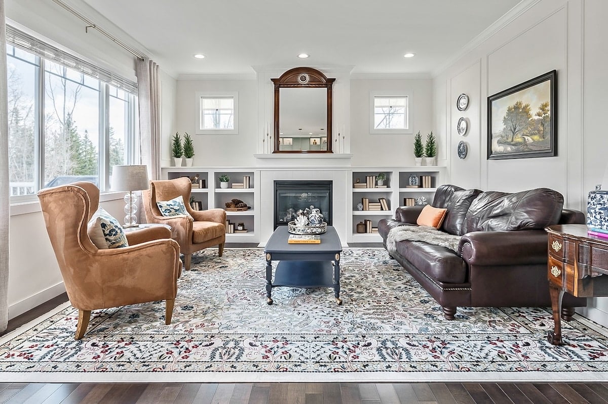 A living room with a fireplace and couches