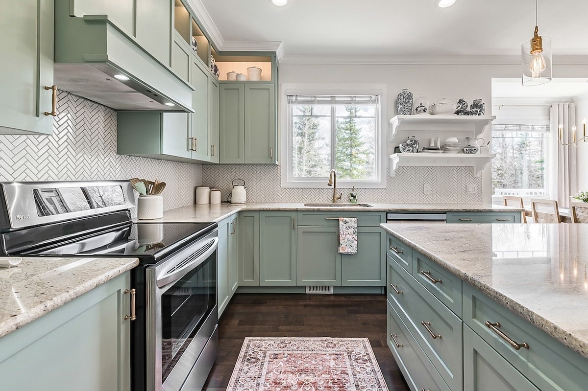 A kitchen with a rug and a window